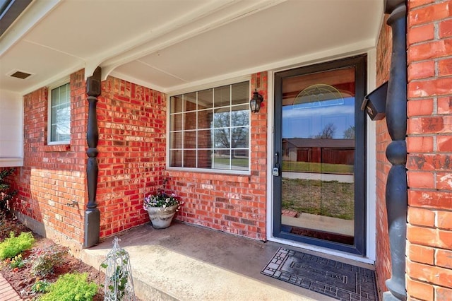 302 Tanglewood Dr, Yukon, OK 73099 - entrance to property featuring brick siding and covered porch