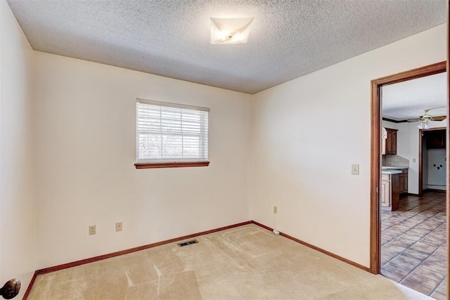 302 Tanglewood Dr, Yukon, OK 73099 - carpeted empty room featuring a textured ceiling and ceiling fan