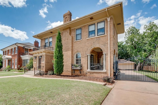 707 NE 18th St, Oklahoma City, OK 73105 - view of front of home featuring a gate, brick siding, a chimney, and concrete driveway