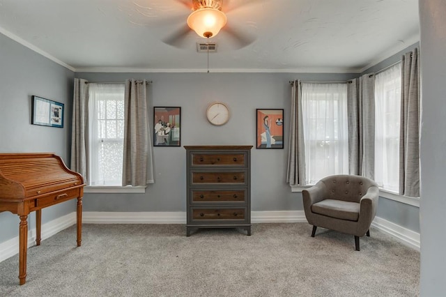 707 NE 18th St, Oklahoma City, OK 73105 - living area featuring light carpet, a ceiling fan, and ornamental molding