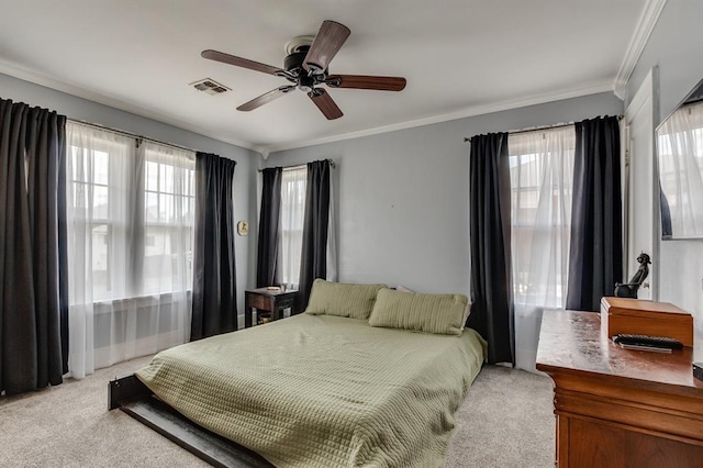 707 NE 18th St, Oklahoma City, OK 73105 - bedroom featuring light carpet, crown molding, and a ceiling fan