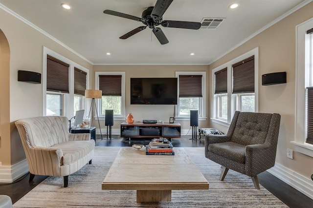 707 NE 18th St, Oklahoma City, OK 73105 - living area featuring arched walkways, crown molding, a ceiling fan, recessed lighting, and dark wood finished floors