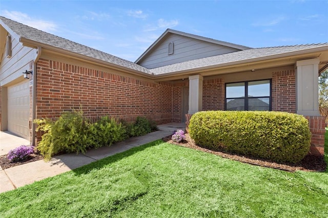 1908 E View Dr, Norman, OK 73071 - single story home featuring brick siding, an attached garage, a front lawn, and roof with shingles