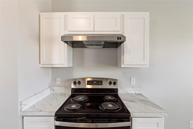 1908 E View Dr, Norman, OK 73071 - kitchen with stainless steel range with electric stovetop, under cabinet range hood, light countertops, and white cabinets