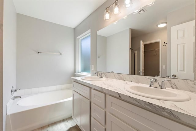 1908 E View Dr, Norman, OK 73071 - full bathroom featuring double vanity, a garden tub, and a spacious closet