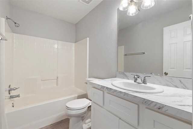 1908 E View Dr, Norman, OK 73071 - bathroom featuring vanity,  shower combination, wood finished floors, and a textured wall