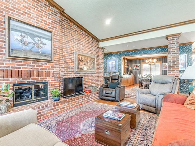 9 Country Club Rd, Shawnee, OK 74801 - living room featuring crown molding, a chandelier, a brick fireplace, wood finished floors, and wallpapered walls