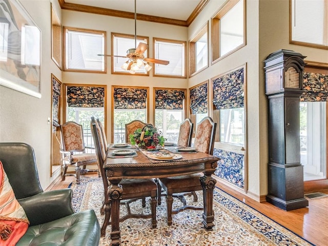 9 Country Club Rd, Shawnee, OK 74801 - dining area with ceiling fan, healthy amount of natural light, crown molding, wood finished floors, and baseboards