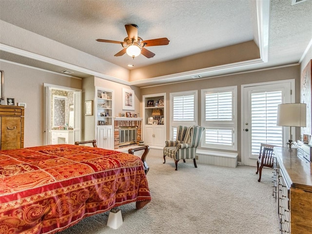 9 Country Club Rd, Shawnee, OK 74801 - carpeted bedroom featuring a textured ceiling, crown molding, a fireplace, and ceiling fan