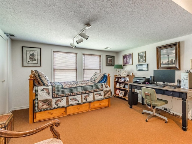 9 Country Club Rd, Shawnee, OK 74801 - carpeted bedroom featuring a textured ceiling and a desk