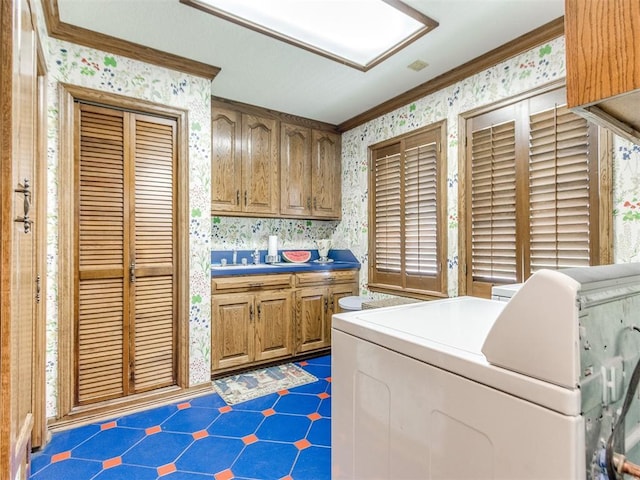 9 Country Club Rd, Shawnee, OK 74801 - laundry room with wallpapered walls, ornamental molding, and washer / clothes dryer