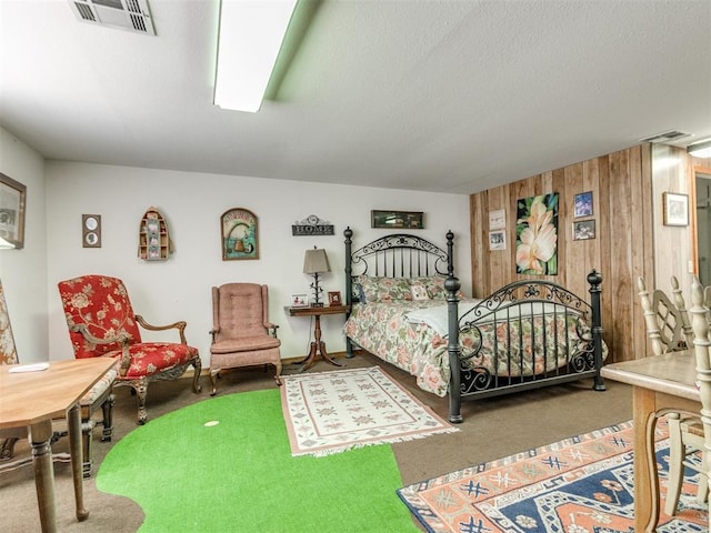 9 Country Club Rd, Shawnee, OK 74801 - bedroom featuring carpet flooring, wooden walls, and a textured ceiling