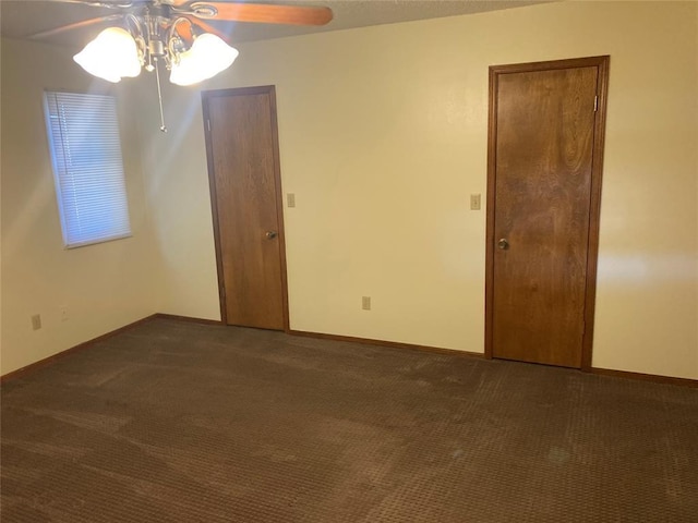 103 N Armor Ave, Canton, OK 73724 - unfurnished room featuring ceiling fan, dark carpet, and baseboards