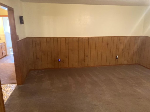 103 N Armor Ave, Canton, OK 73724 - carpeted spare room with wainscoting and wooden walls