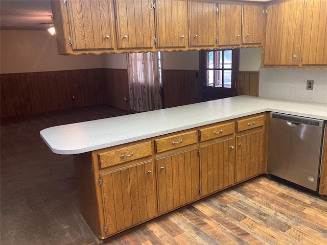 103 N Armor Ave, Canton, OK 73724 - kitchen featuring stainless steel dishwasher, light countertops, brown cabinets, and dark wood-type flooring