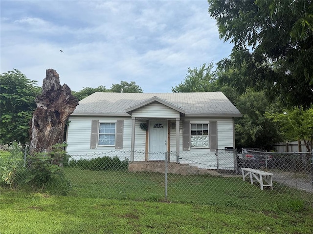 3427 Campbell Pl, Oklahoma City, OK 73108 - bungalow-style house featuring a fenced front yard