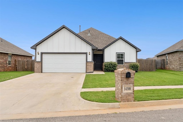 14308 Peach Tree Dr, Yukon, OK 73099 - view of front of property with board and batten siding, an attached garage, driveway, roof with shingles, and brick siding