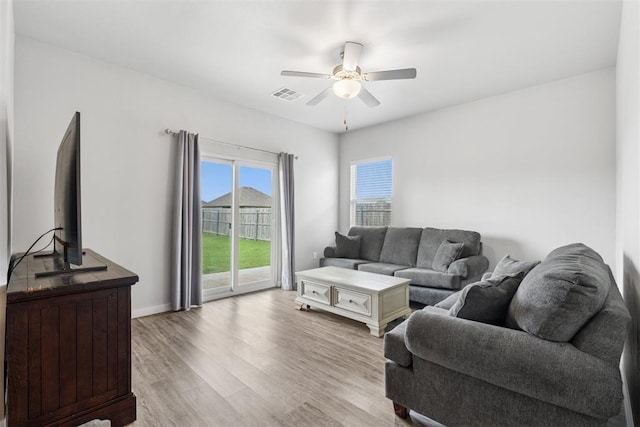 14308 Peach Tree Dr, Yukon, OK 73099 - living area with wood finished floors and a ceiling fan
