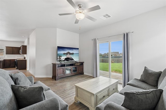 14308 Peach Tree Dr, Yukon, OK 73099 - living room with a ceiling fan and light wood-type flooring