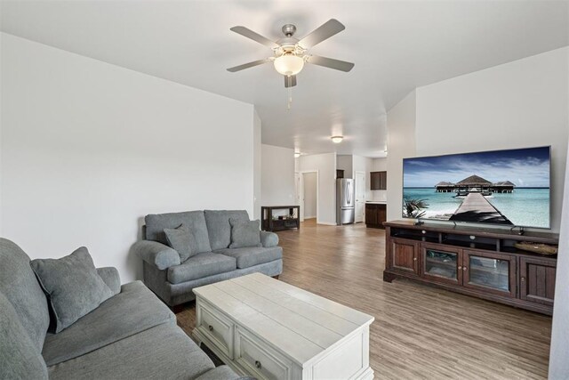 14308 Peach Tree Dr, Yukon, OK 73099 - living area with ceiling fan and light wood-type flooring