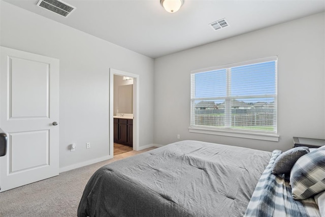 14308 Peach Tree Dr, Yukon, OK 73099 - bedroom featuring light carpet and ensuite bathroom