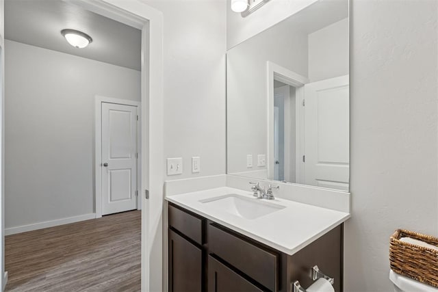 14308 Peach Tree Dr, Yukon, OK 73099 - bathroom with vanity and wood finished floors