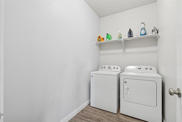 14308 Peach Tree Dr, Yukon, OK 73099 - laundry room featuring washing machine and clothes dryer and wood finished floors