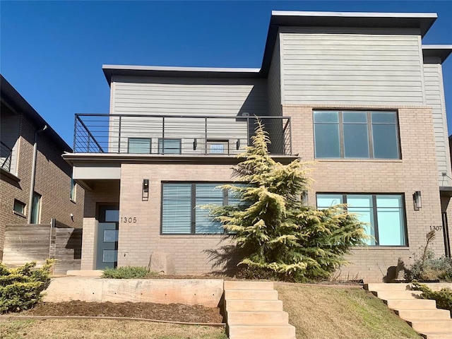 1305 NE 6th St, Oklahoma City, OK 73117 - modern home with a balcony and brick siding