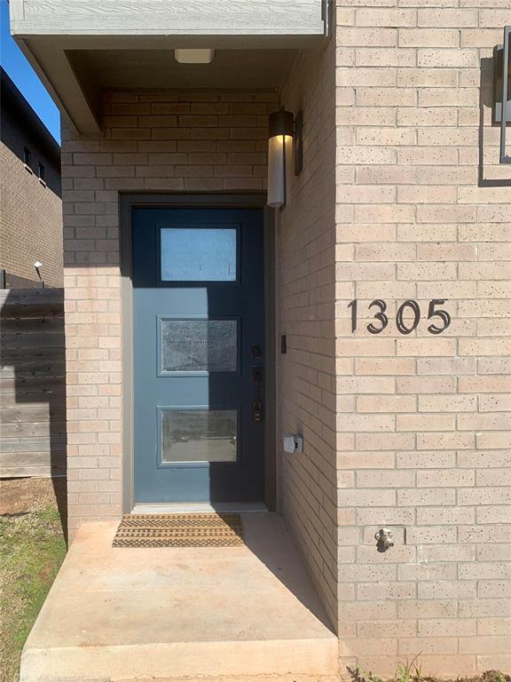 1305 NE 6th St, Oklahoma City, OK 73117 - view of exterior entry with brick siding