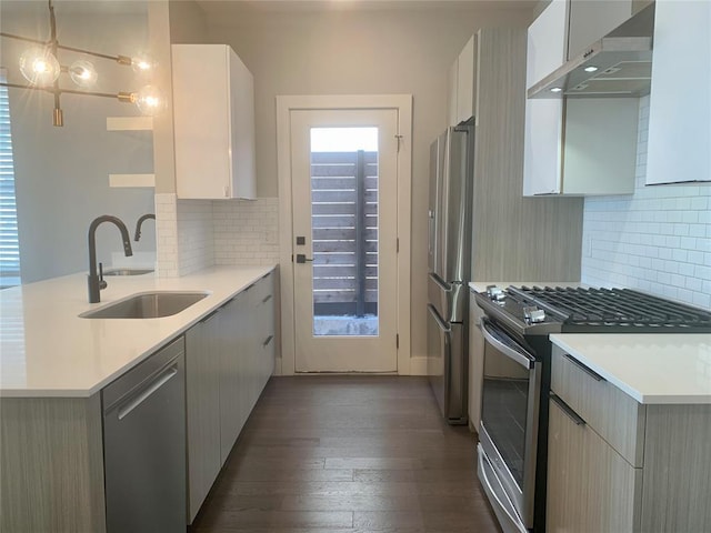 1305 NE 6th St, Oklahoma City, OK 73117 - kitchen with stainless steel appliances, wall chimney exhaust hood, a peninsula, and light countertops