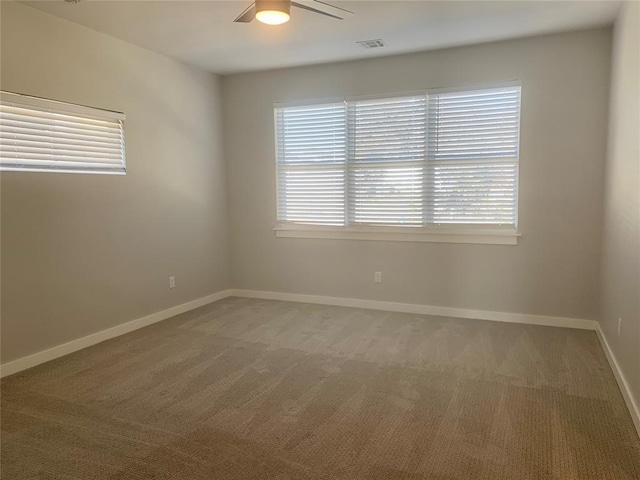 1305 NE 6th St, Oklahoma City, OK 73117 - carpeted spare room with healthy amount of natural light and ceiling fan