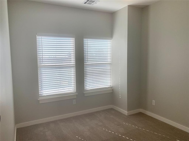 1305 NE 6th St, Oklahoma City, OK 73117 - carpeted empty room with healthy amount of natural light