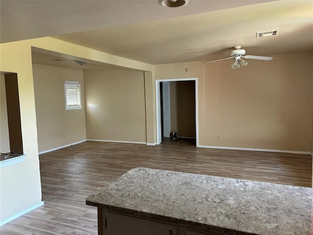 1540 Cross Rd, Altus, OK 29483 - empty room with a ceiling fan and light wood finished floors