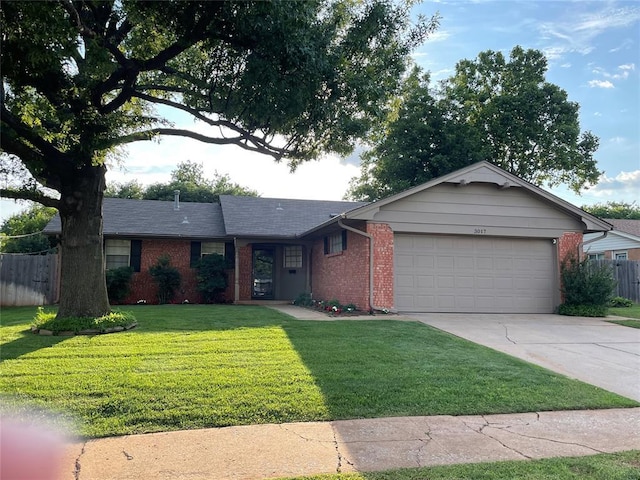 3017 Kelsey Dr, Edmond, OK 73013 - ranch-style home with brick siding, a garage, and concrete driveway