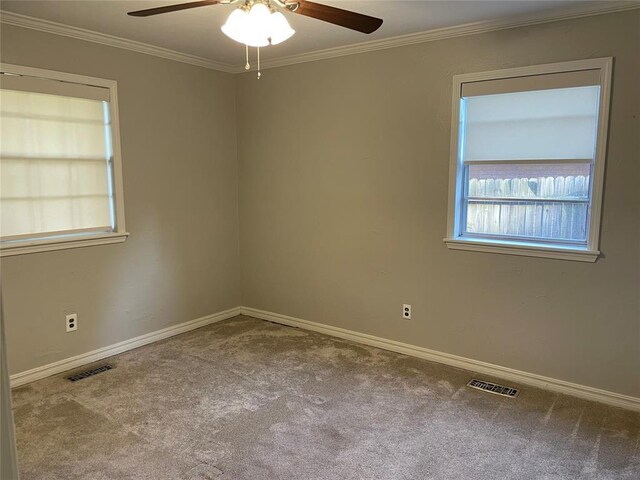 3017 Kelsey Dr, Edmond, OK 73013 - unfurnished room featuring ceiling fan, carpet flooring, crown molding, and baseboards