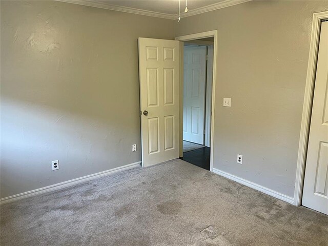 3017 Kelsey Dr, Edmond, OK 73013 - unfurnished room with carpet floors, baseboards, and crown molding