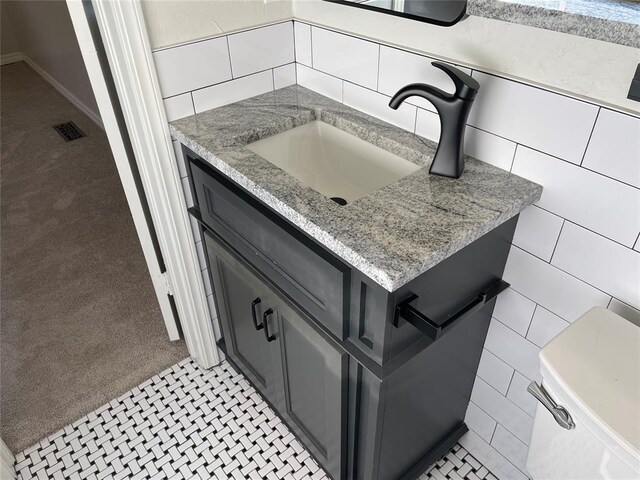 3017 Kelsey Dr, Edmond, OK 73013 - bathroom view of carpet flooring, vanity, and tile walls