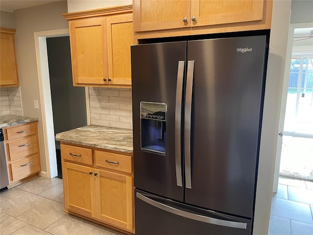 3017 Kelsey Dr, Edmond, OK 73013 - kitchen featuring stainless steel appliances, tasteful backsplash, light tile patterned floors, and light stone counters