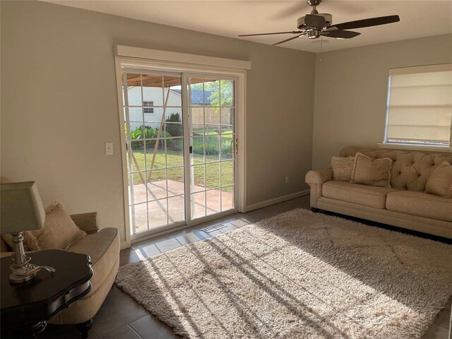 3017 Kelsey Dr, Edmond, OK 73013 - tiled living room with a ceiling fan