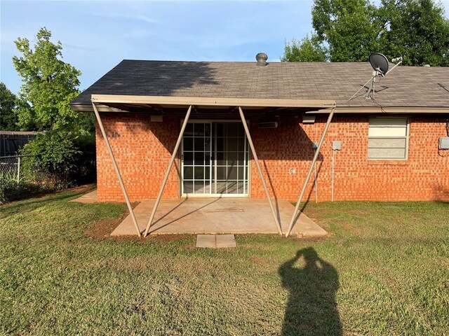 3017 Kelsey Dr, Edmond, OK 73013 - rear view of property with a patio, brick siding, and a shingled roof