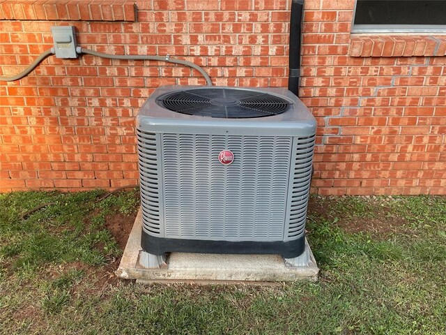 3017 Kelsey Dr, Edmond, OK 73013 - exterior view of cooling unit and brick siding