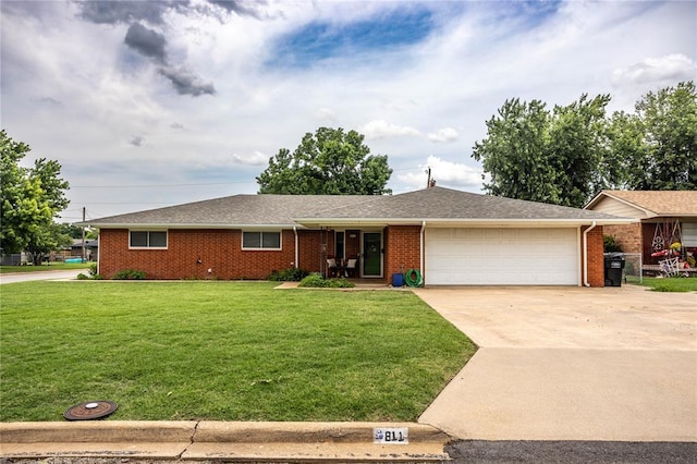 801 N Hunt St, Hydro, OK 73048 - ranch-style house featuring a garage, concrete driveway, a front yard, and brick siding