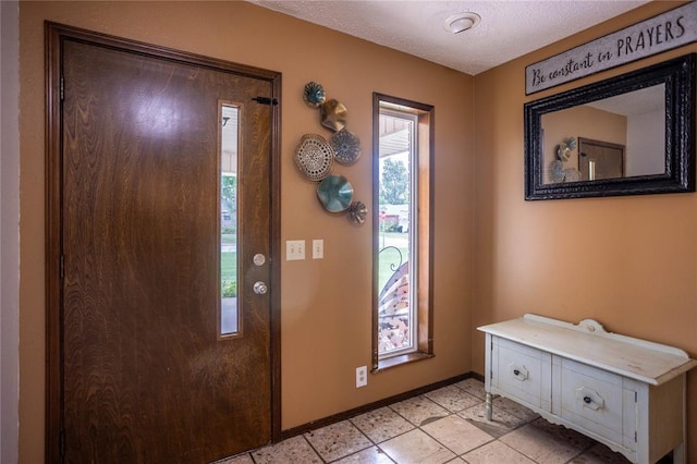 801 N Hunt St, Hydro, OK 73048 - entrance foyer with baseboards and a textured ceiling