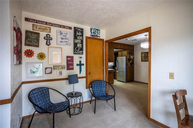 801 N Hunt St, Hydro, OK 73048 - living area with a textured ceiling and carpet flooring