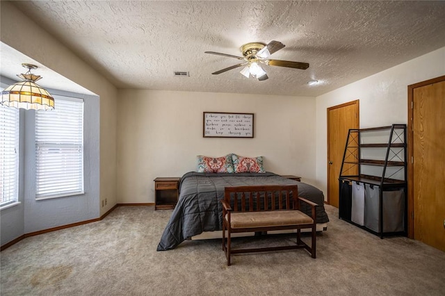 801 N Hunt St, Hydro, OK 73048 - bedroom with a textured ceiling, light carpet, and a ceiling fan