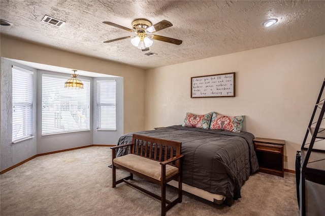 801 N Hunt St, Hydro, OK 73048 - bedroom featuring a textured ceiling, carpet, and ceiling fan