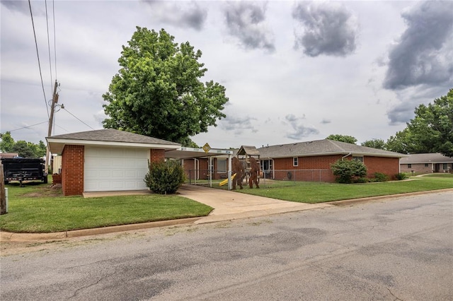 801 N Hunt St, Hydro, OK 73048 - ranch-style house with concrete driveway, brick siding, a garage, and a front yard