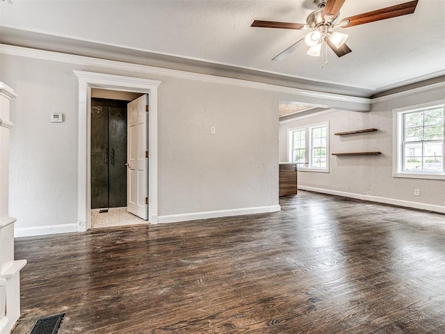 3157 NW 25th St, Oklahoma City, OK 73107 - unfurnished living room with ornamental molding, plenty of natural light, wood finished floors, and ceiling fan