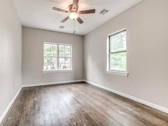3157 NW 25th St, Oklahoma City, OK 73107 - unfurnished room with wood finished floors and a ceiling fan