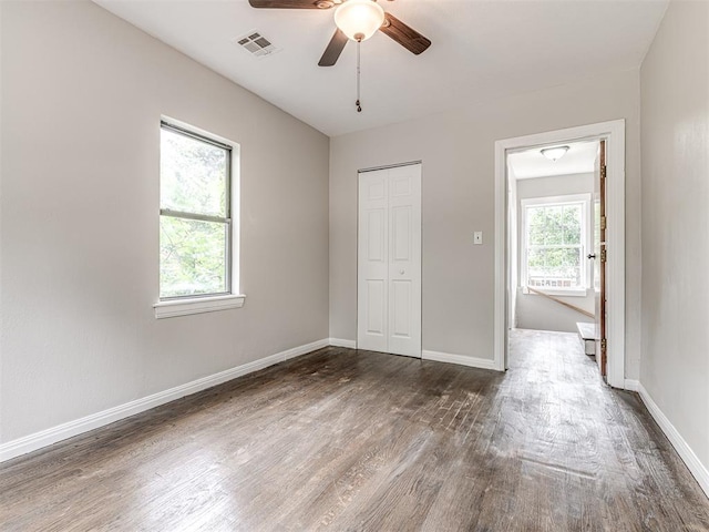 3157 NW 25th St, Oklahoma City, OK 73107 - unfurnished bedroom featuring dark wood finished floors, a closet, and ceiling fan